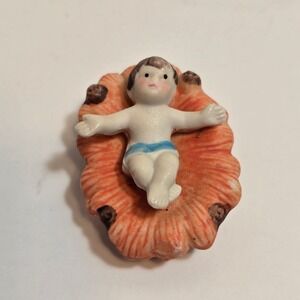 Vintage German Porcelain Nativity Baby Jesus in Cradled Flower Figurine